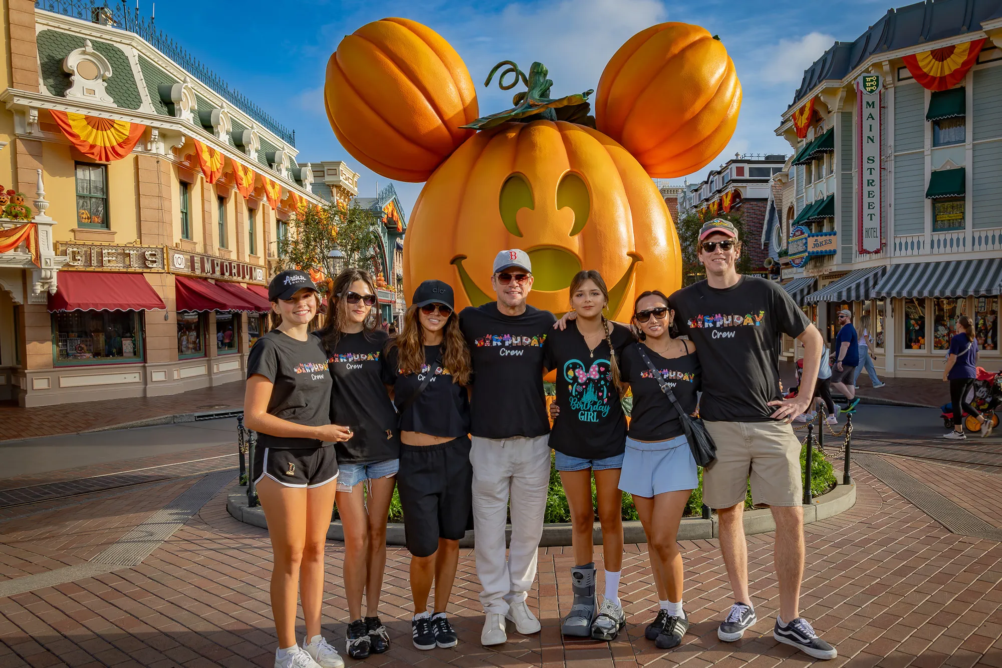 Matt Damon smiling with his family at Disneyland