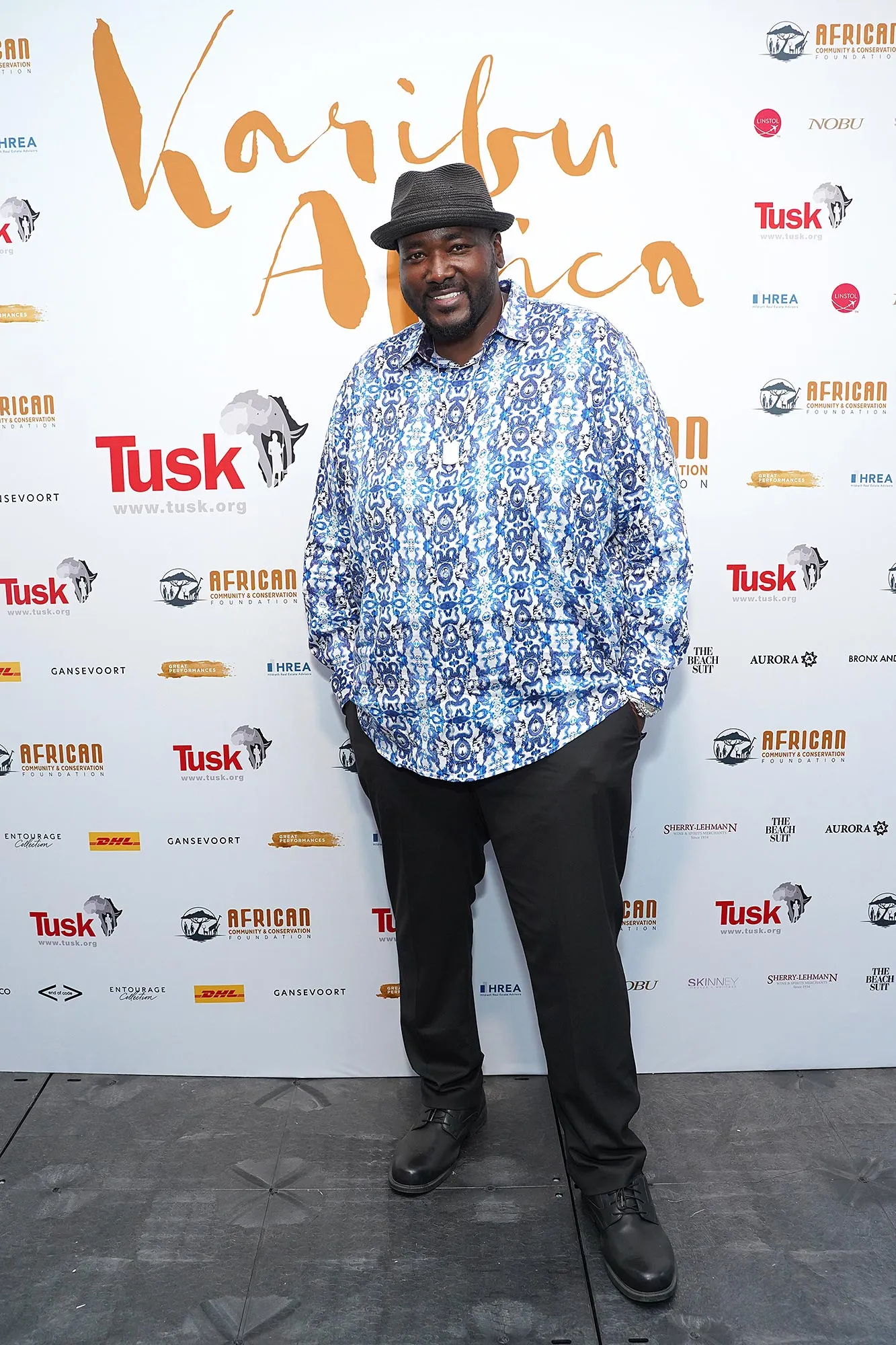 Quinton Aaron posing at a red carpet event