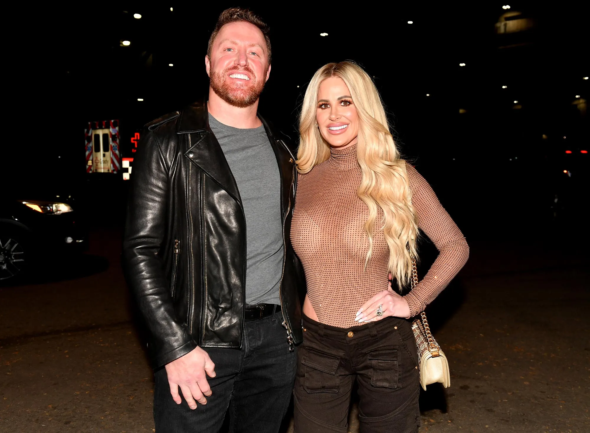 Kroy Biermann posing outdoors in a casual outfit
