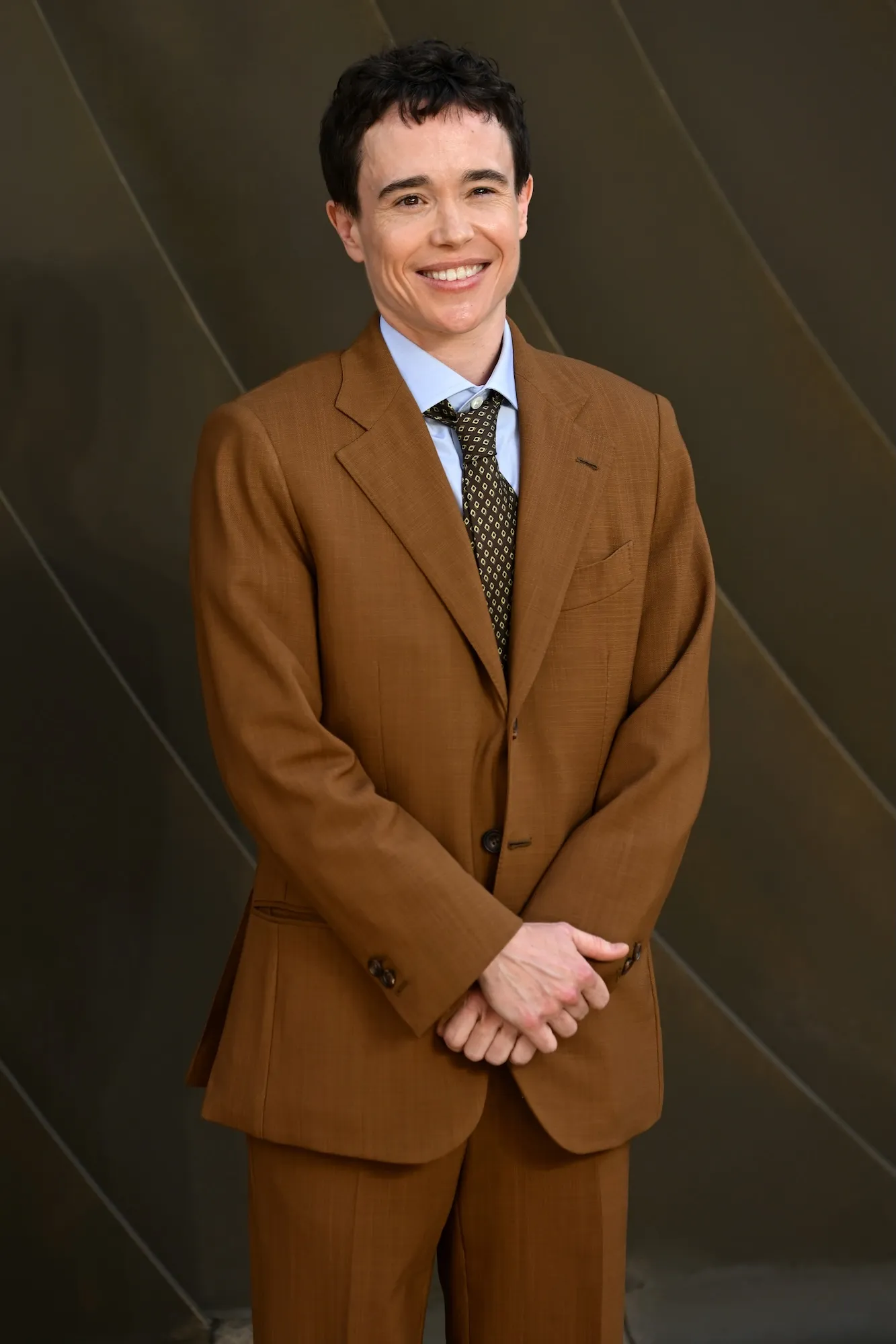 Elliot Page posing on a red carpet event