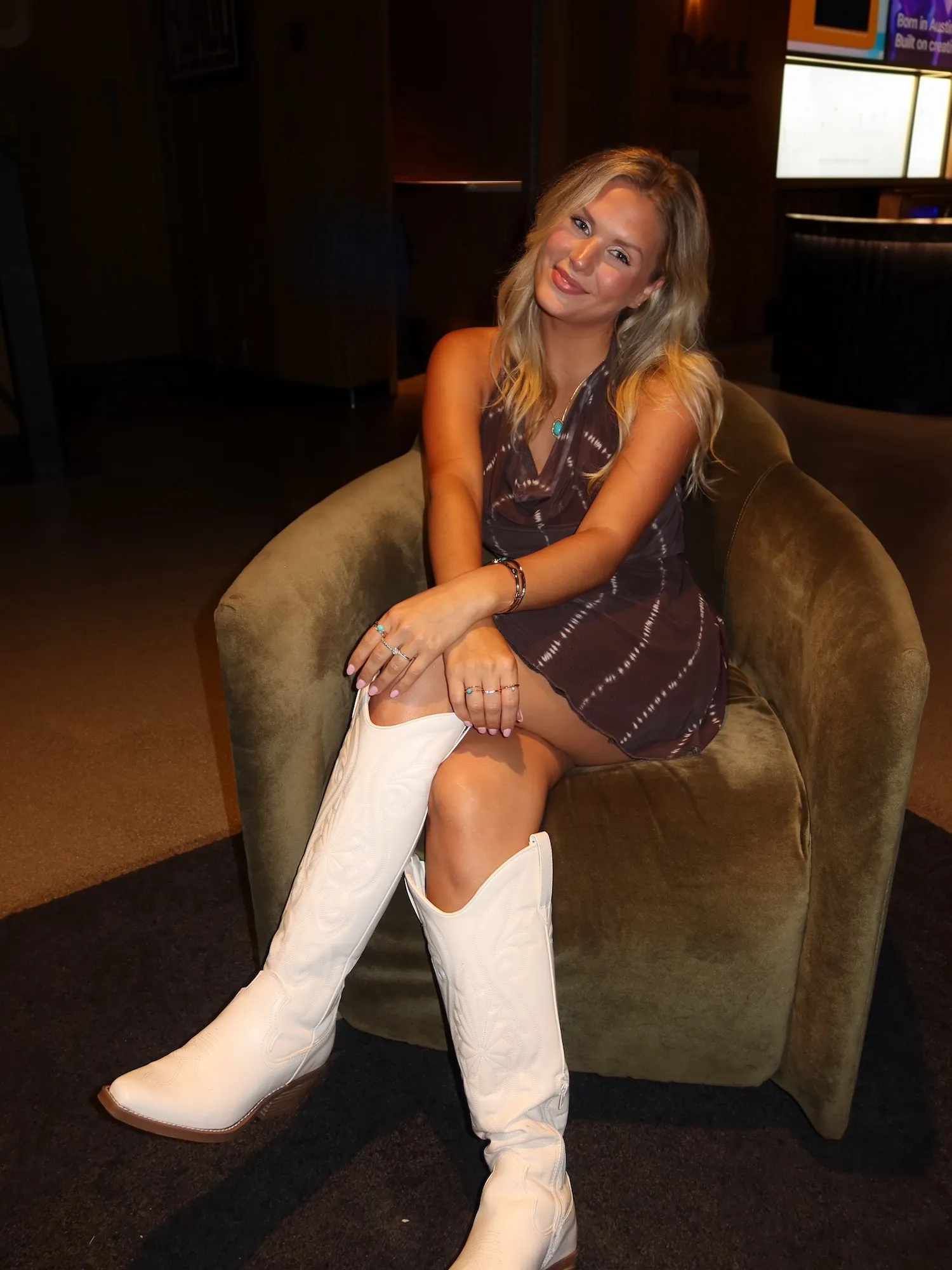 Katie Bates taking a photo after discussing her wardrobe choices on Instagram