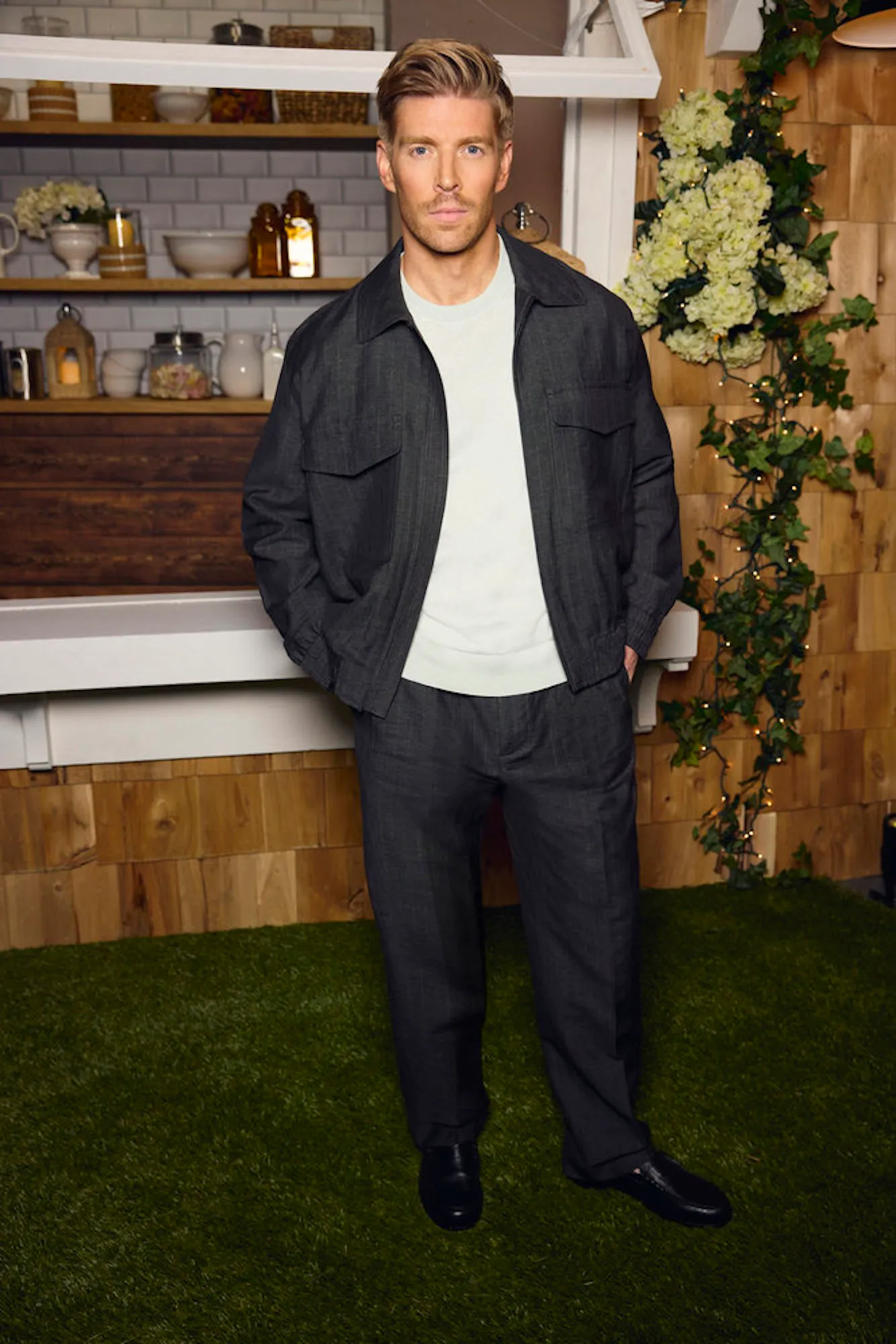 Kyle Cooke posing for photos at a reality television event