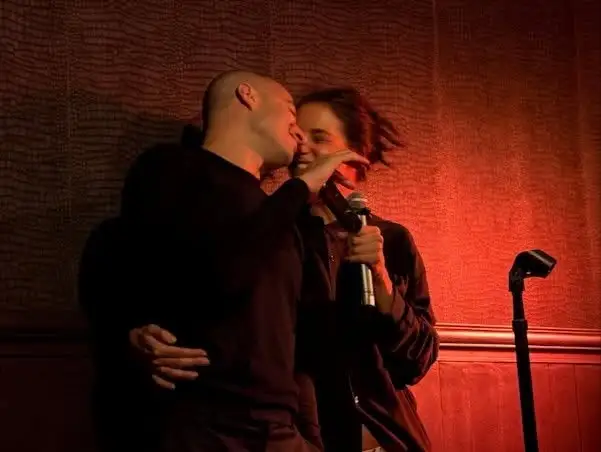 Katie Holmes smiling next to boyfriend Jason Bard Yarmosky during birthday celebration