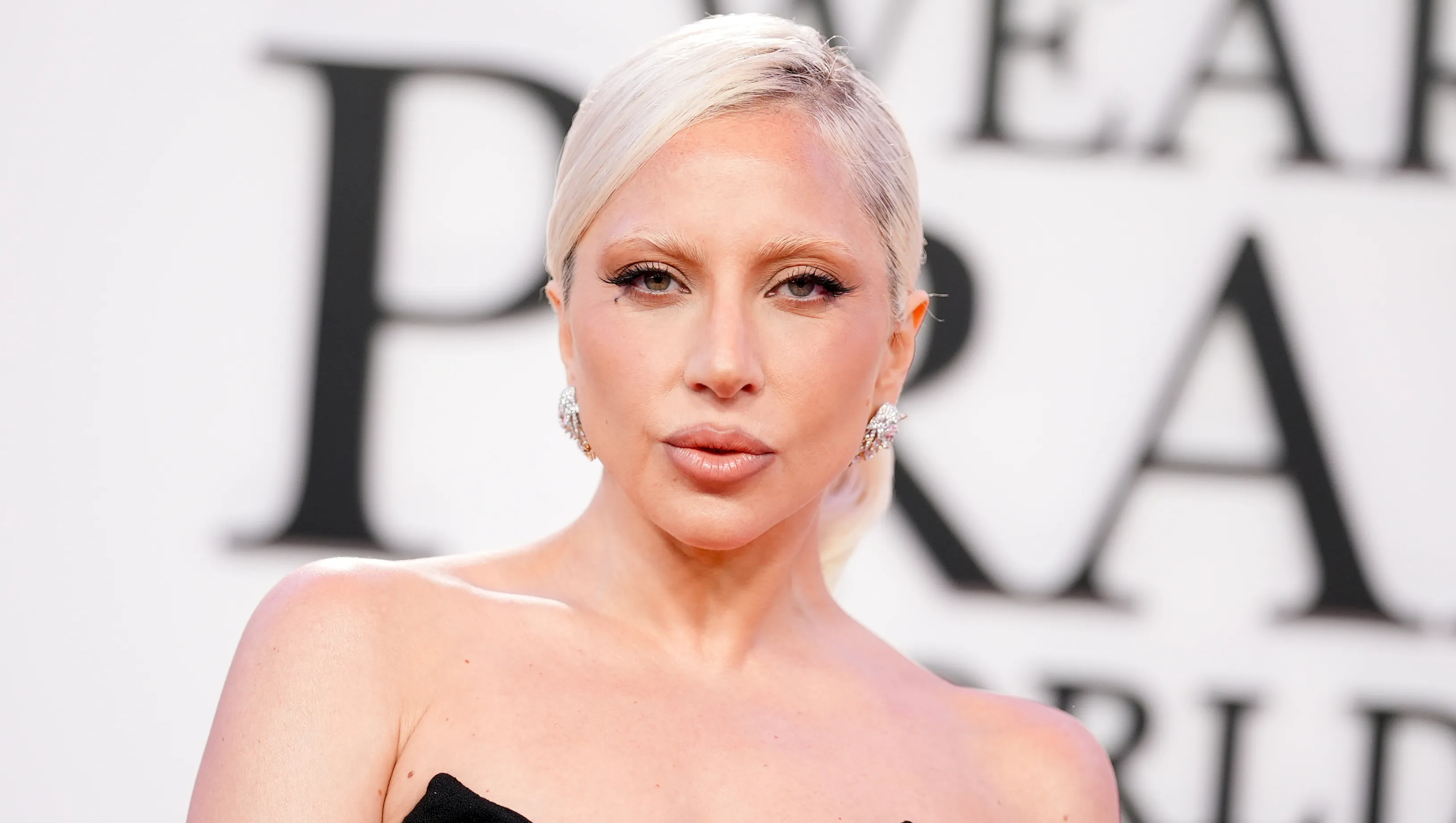 Lady Gaga smiling showing off her glowing skin prep routine