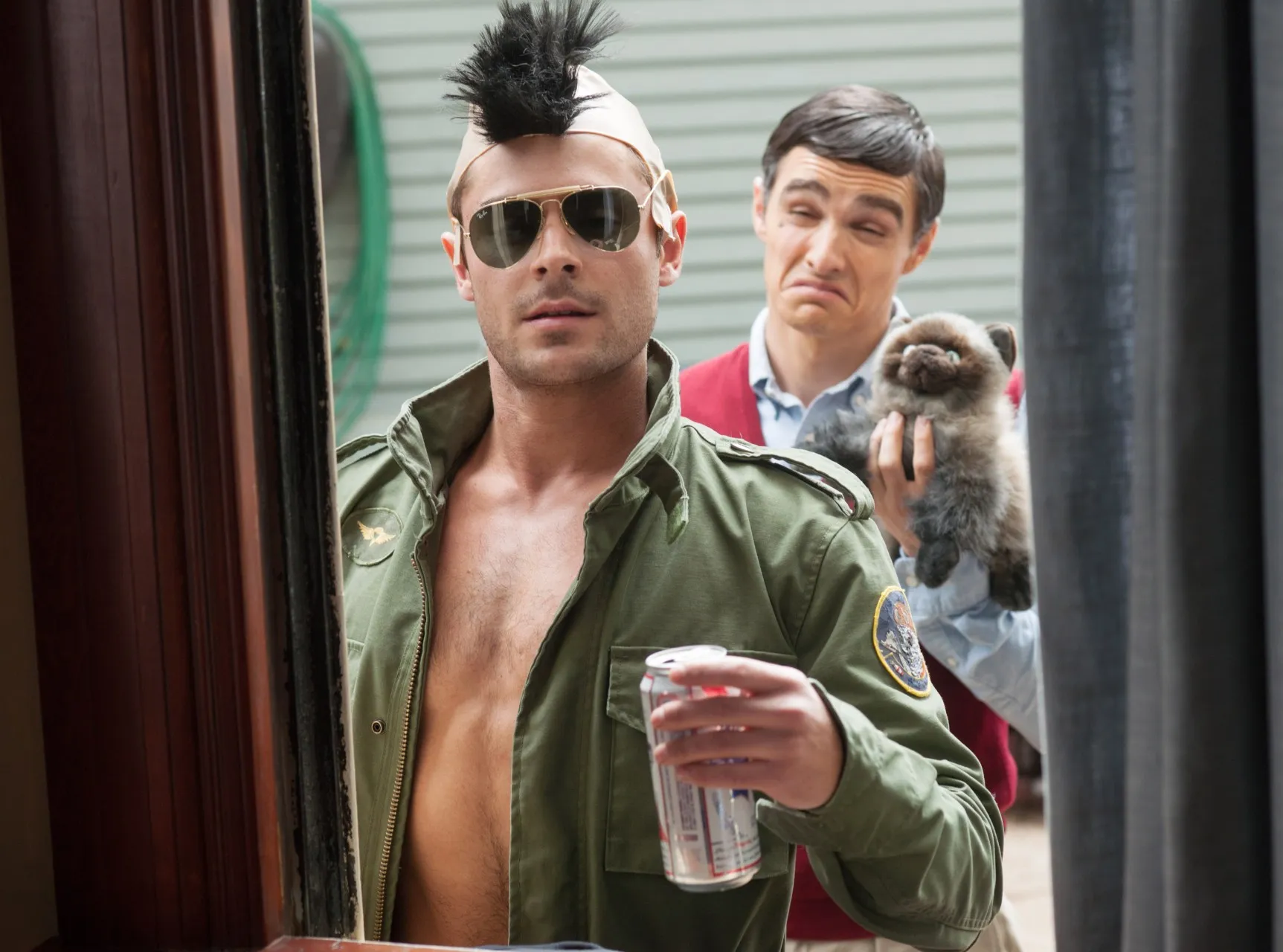 Seth Rogen and Rose Byrne looking stressed in a scene from Neighbors