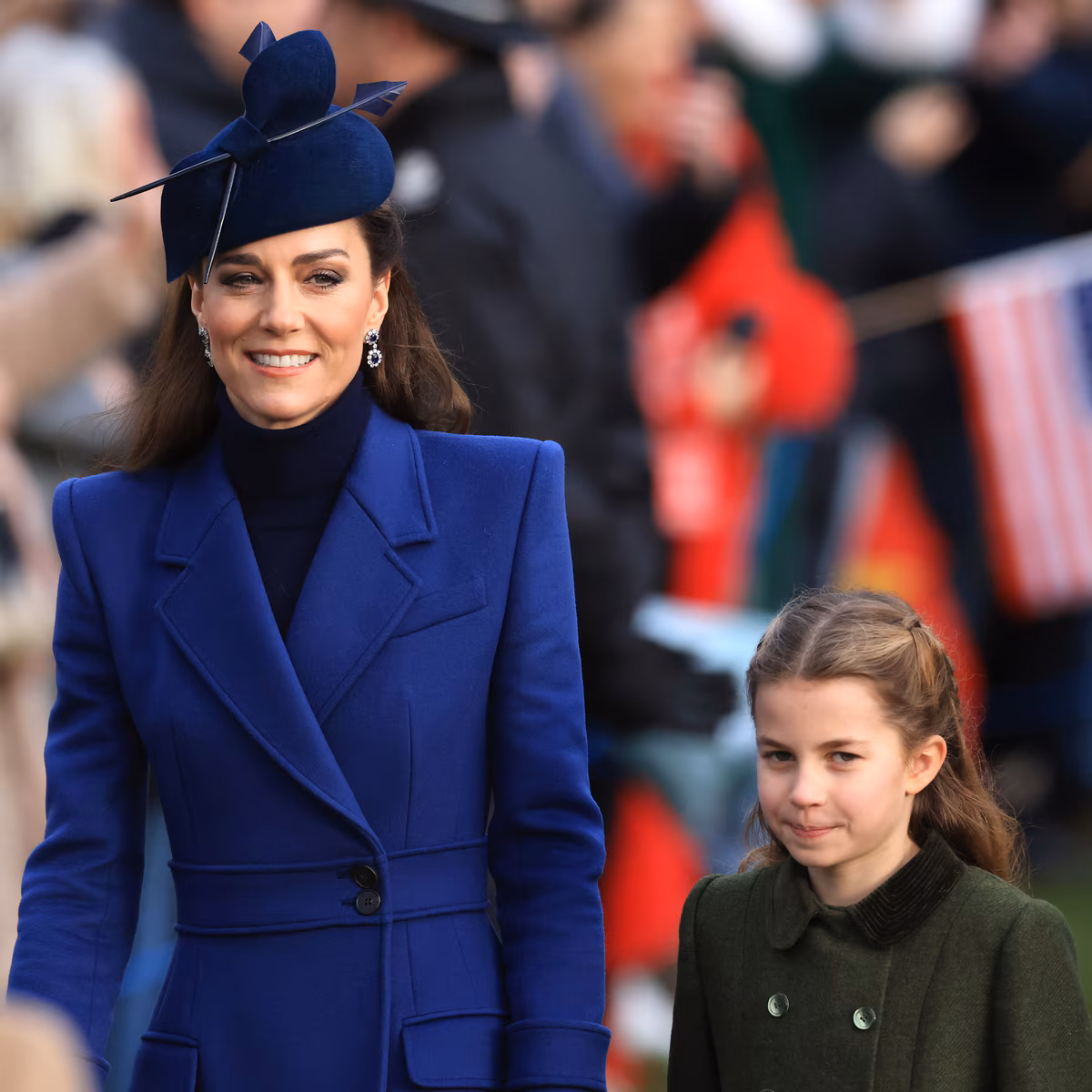 Prince William and Kate Middleton walking with their children at a royal event