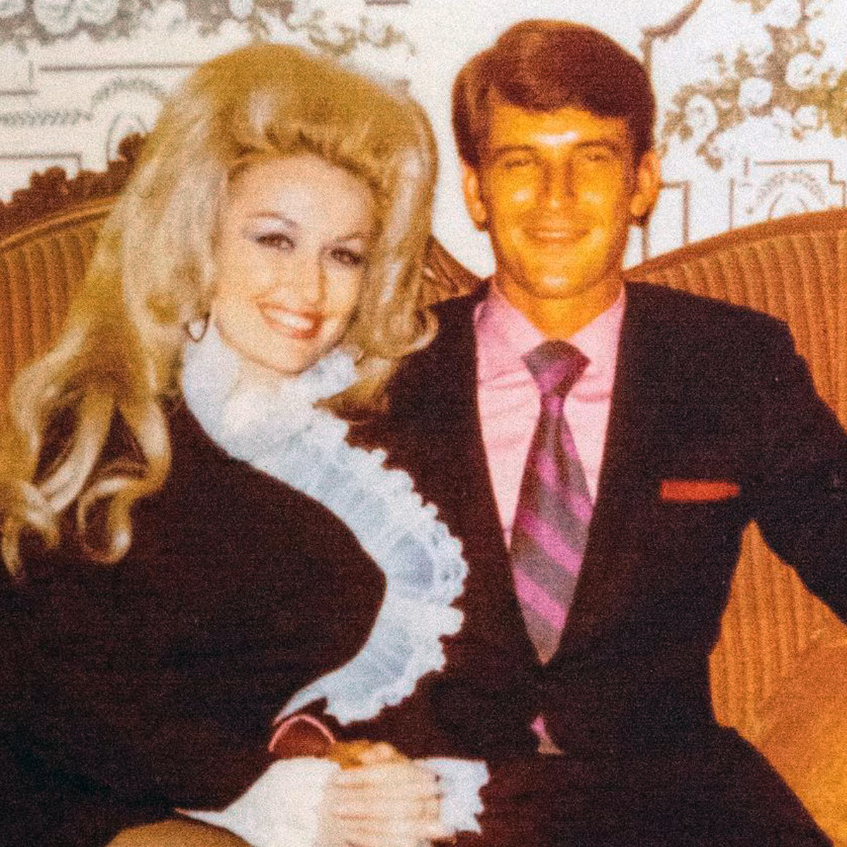 Dolly Parton smiling on stage during a country music event