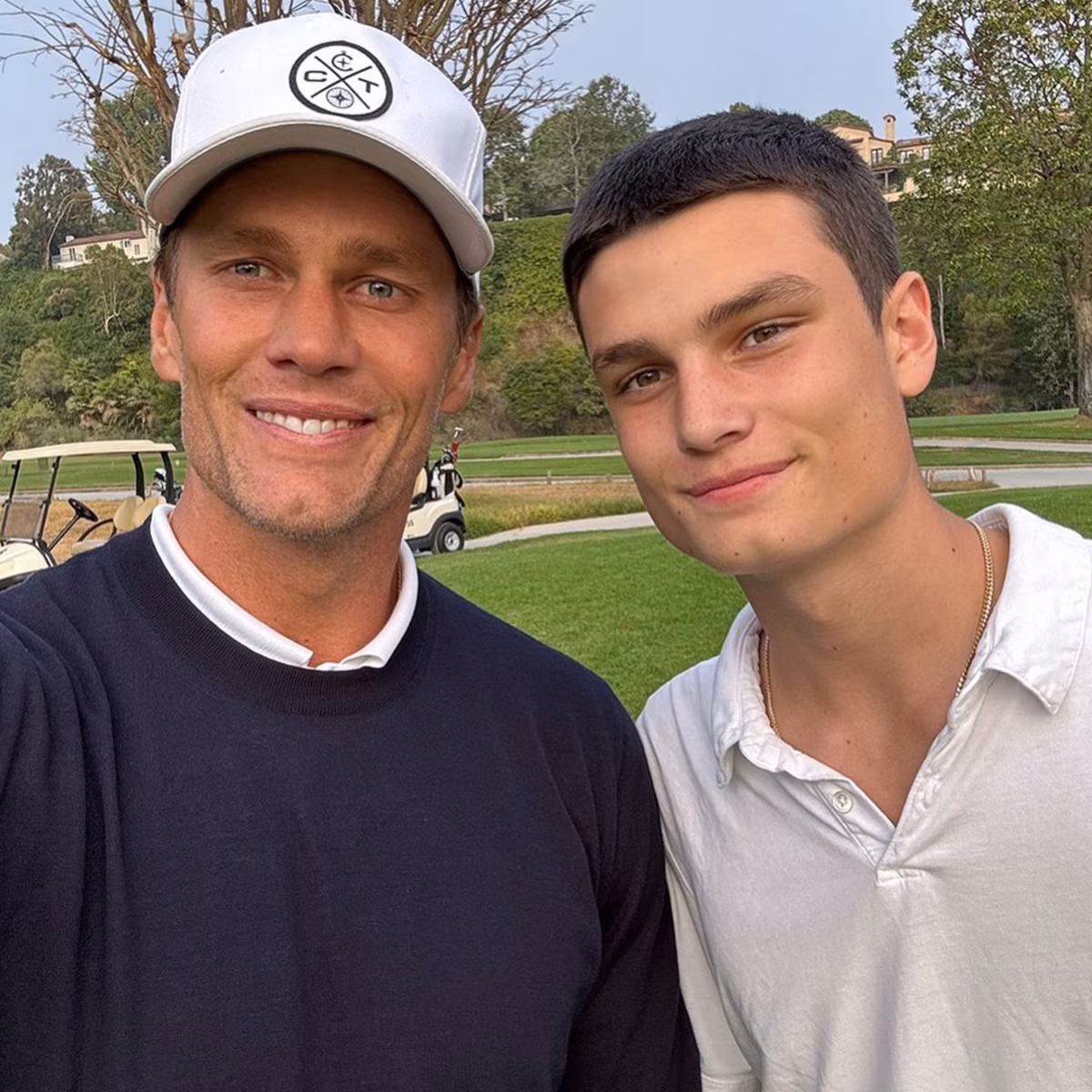 Tom Brady smiling at a public event alongside his son Jack Brady