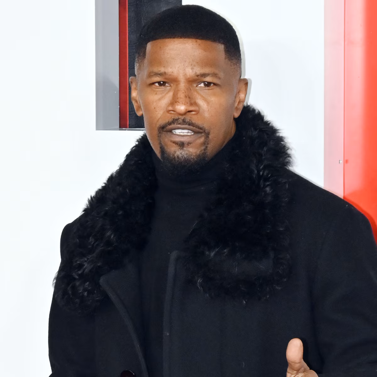 Jamie Foxx smiling on a red carpet event