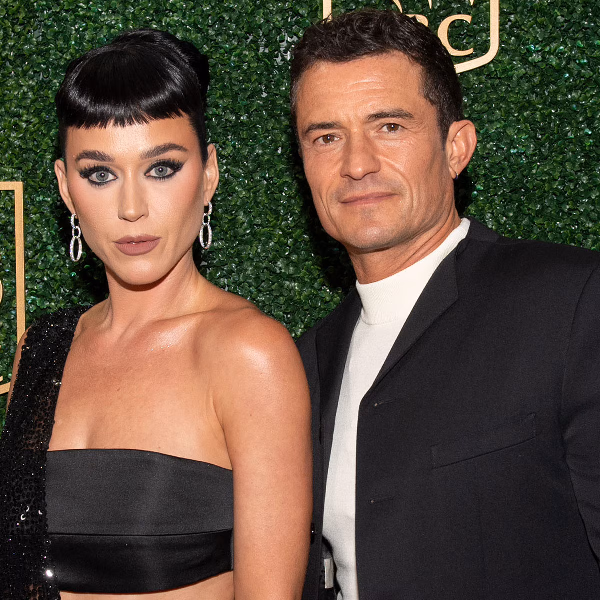 Katy Perry and Orlando Bloom posing together at a high-profile red carpet premiere.