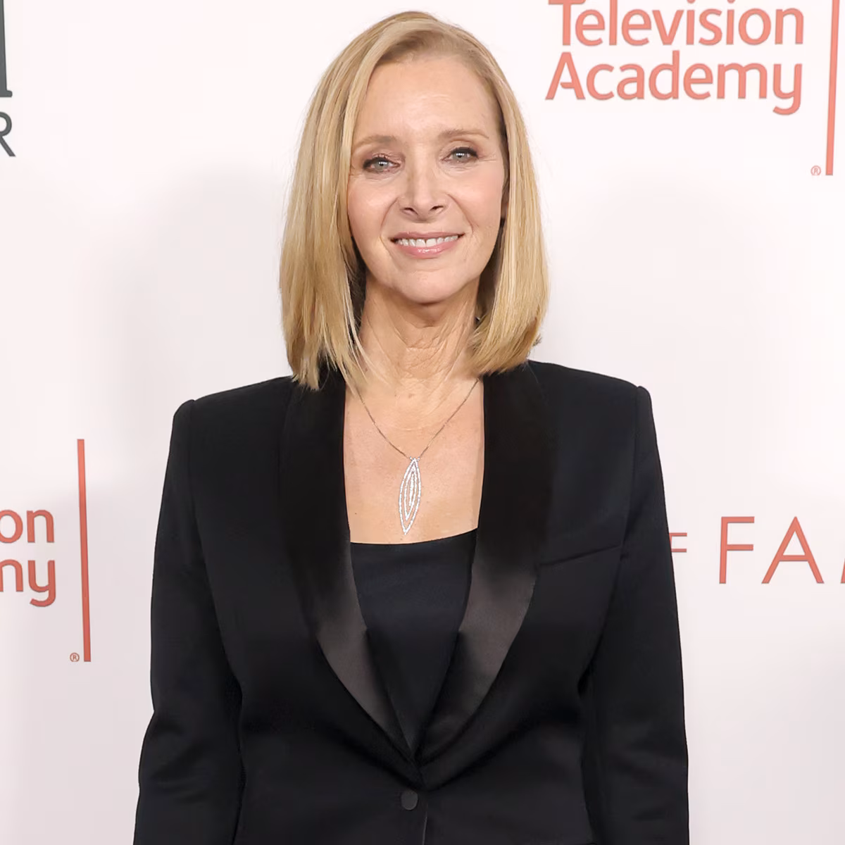 Lisa Kudrow smiling at an entertainment event