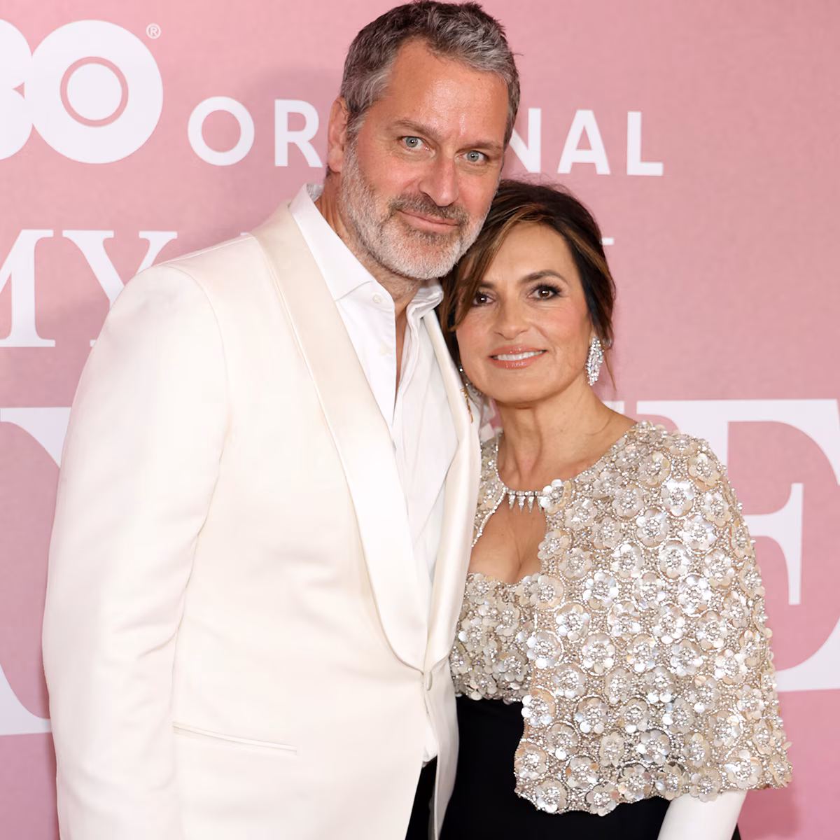 Mariska Hargitay and husband Peter Hermann smiling together at an industry event