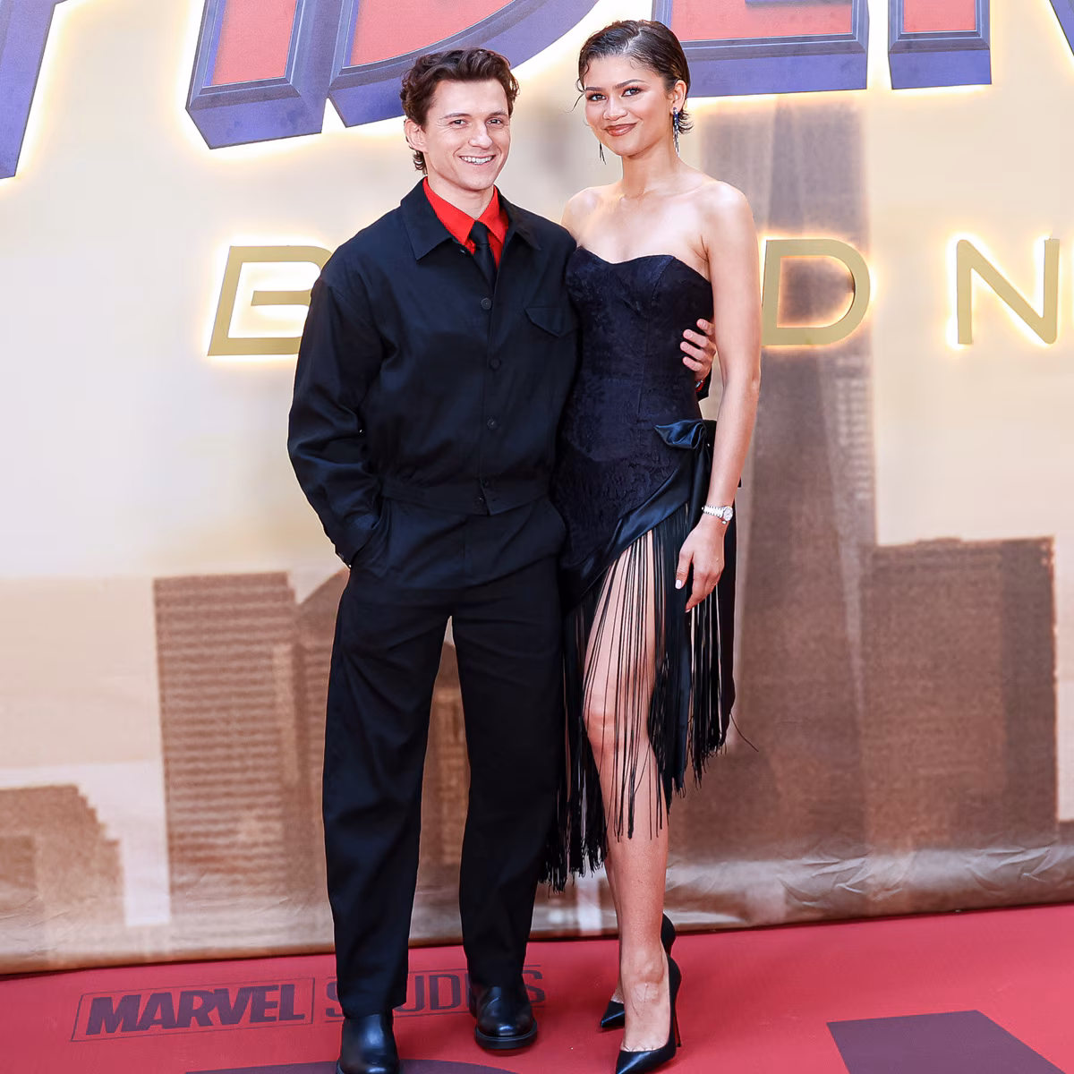 Zendaya and Tom Holland posing together