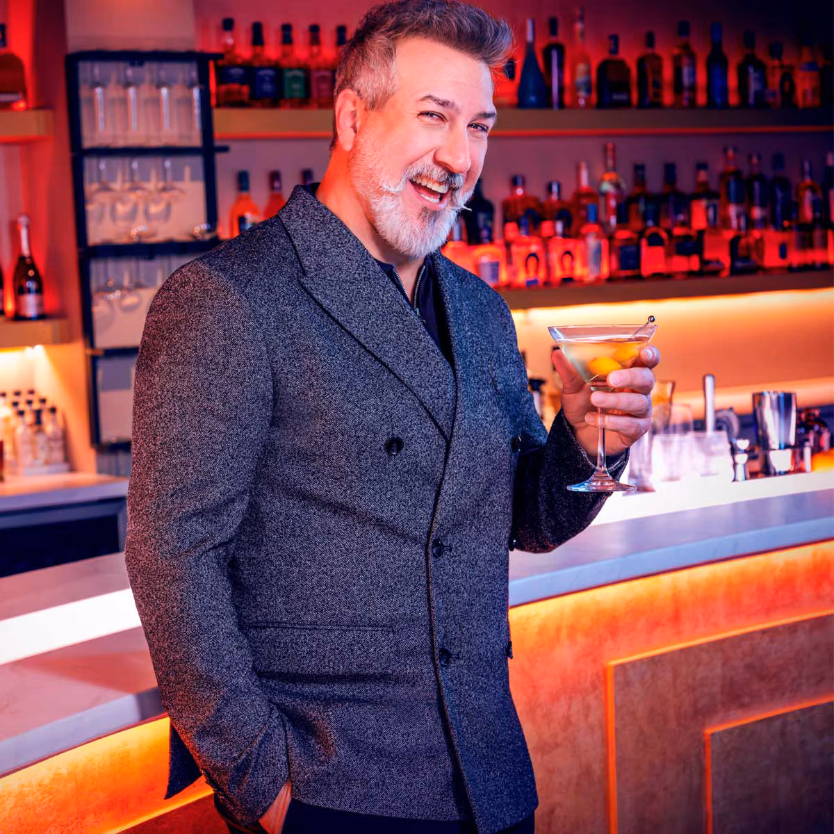 Joey Fatone smiling at an event