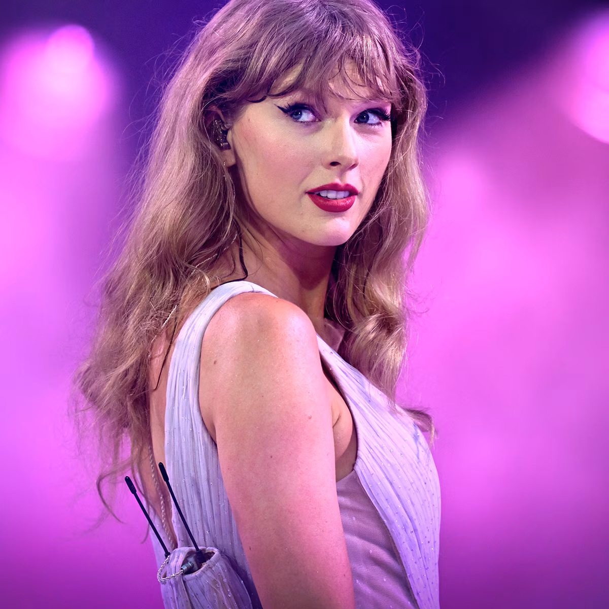 Taylor Swift showing off her signature blonde hair and bangs at a public appearance