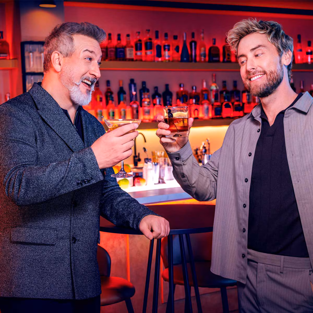 Joey Fatone and Lance Bass posing together at an event