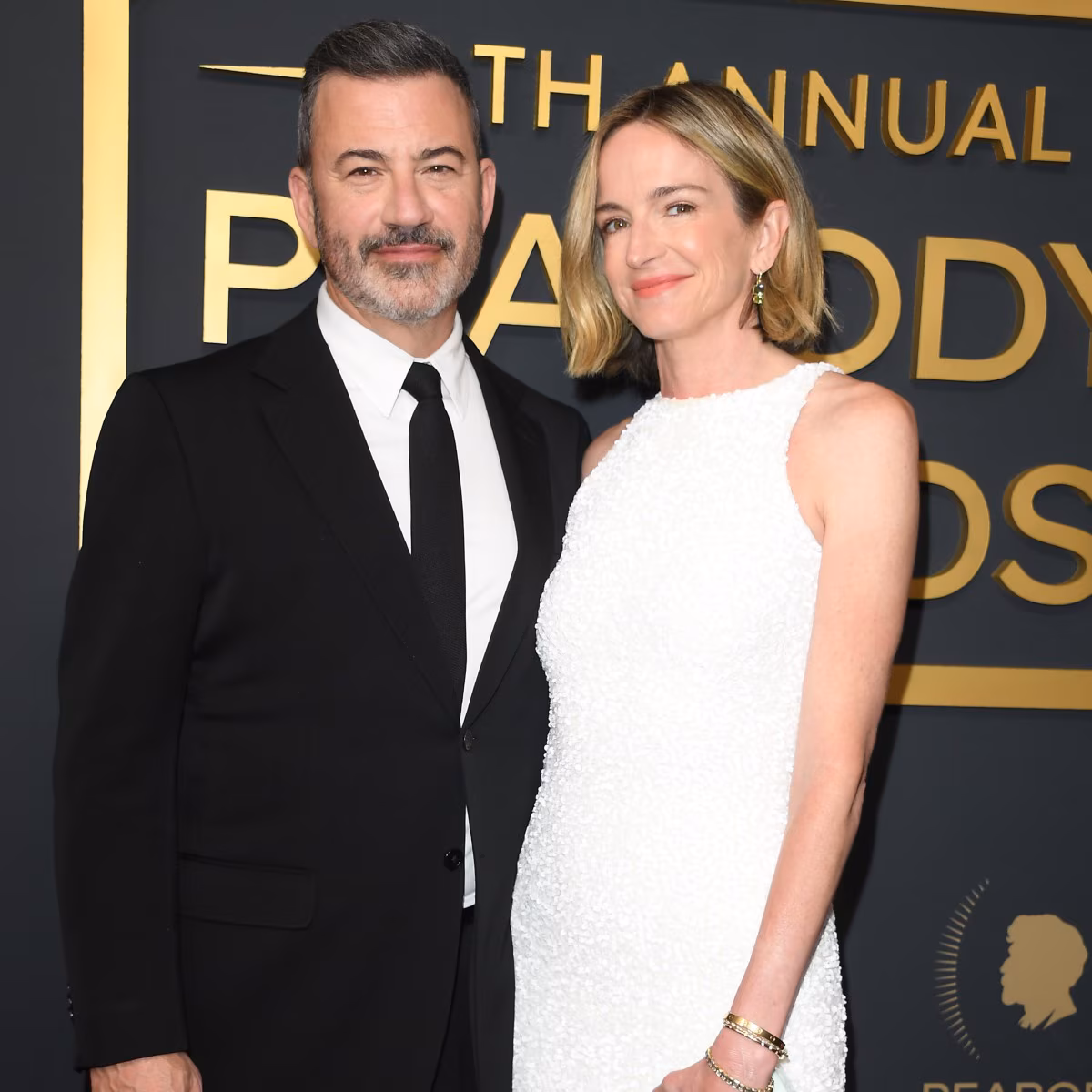 Jimmy Kimmel and Molly McNearney posing together at an event