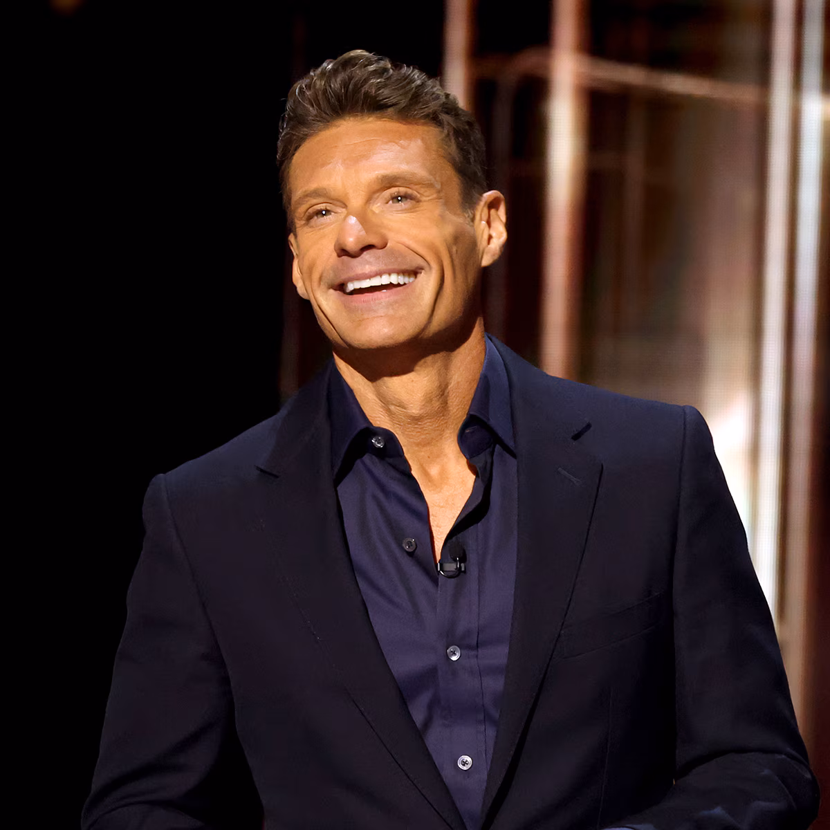 Ryan Seacrest displaying his muscular arm physique in a fitness photo