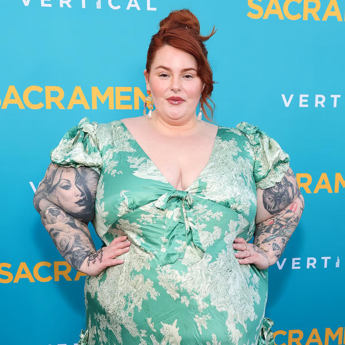 Tess Holliday posing in a swimsuit while vacationing on a yacht in Italy.