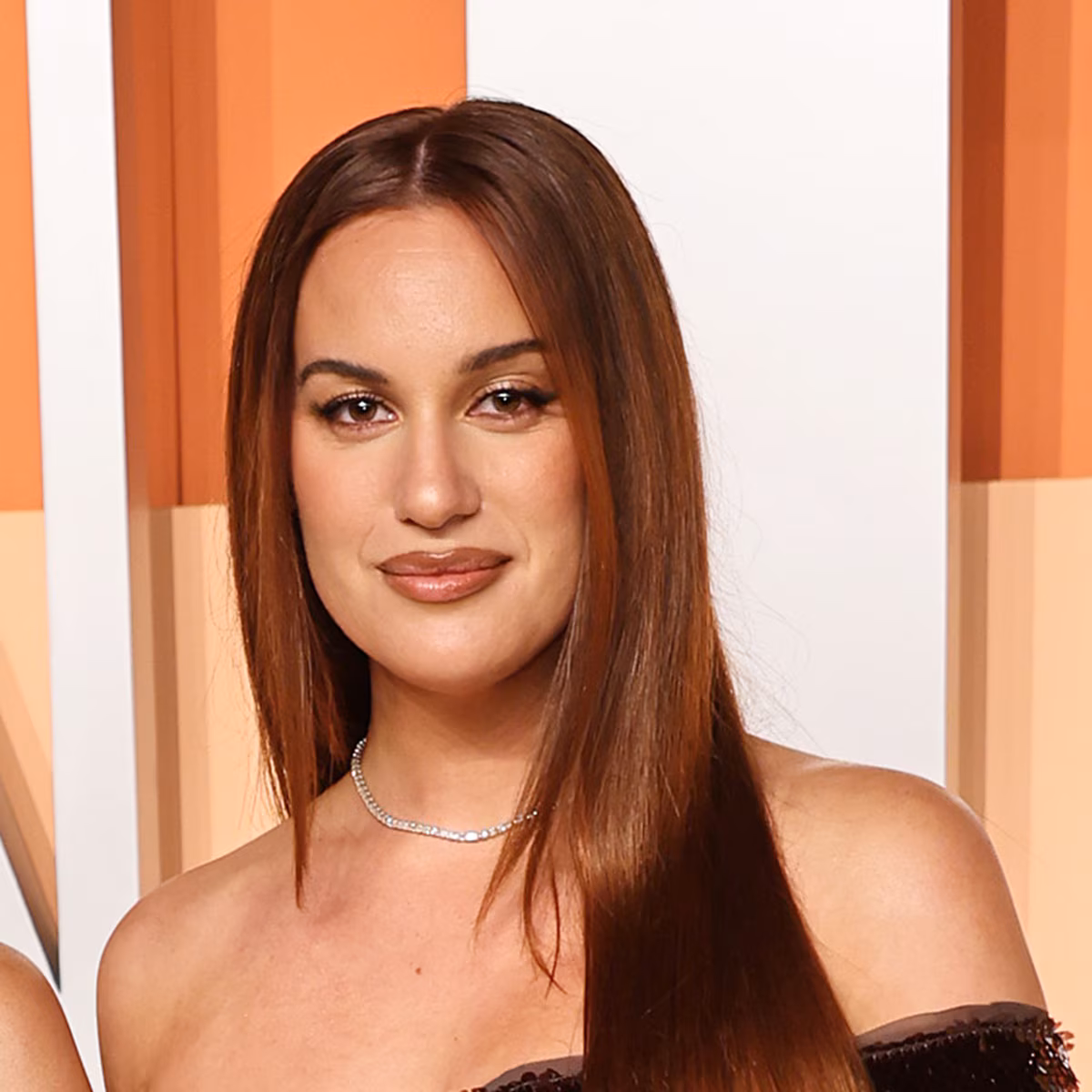 Hannah Berner smiling at a red carpet event