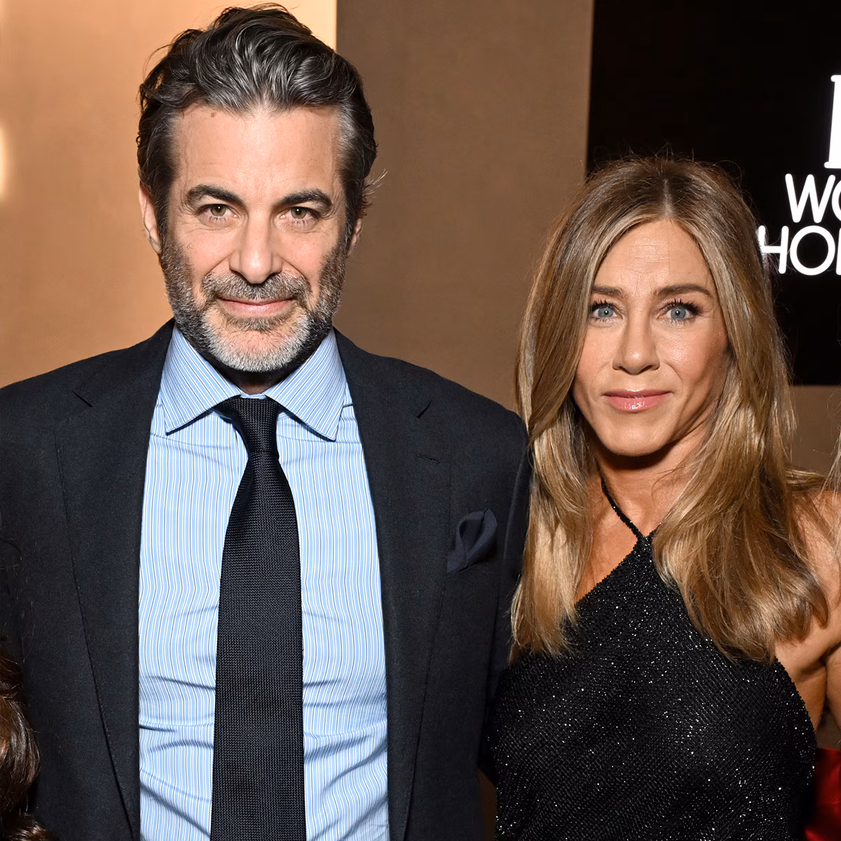 Jennifer Aniston smiling on a red carpet event