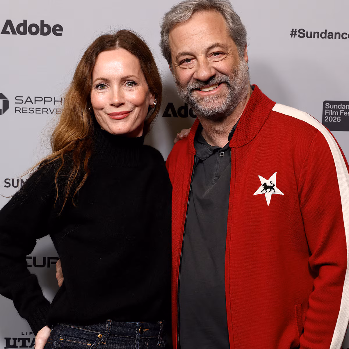 Leslie Mann and Judd Apatow posing together on a red carpet.