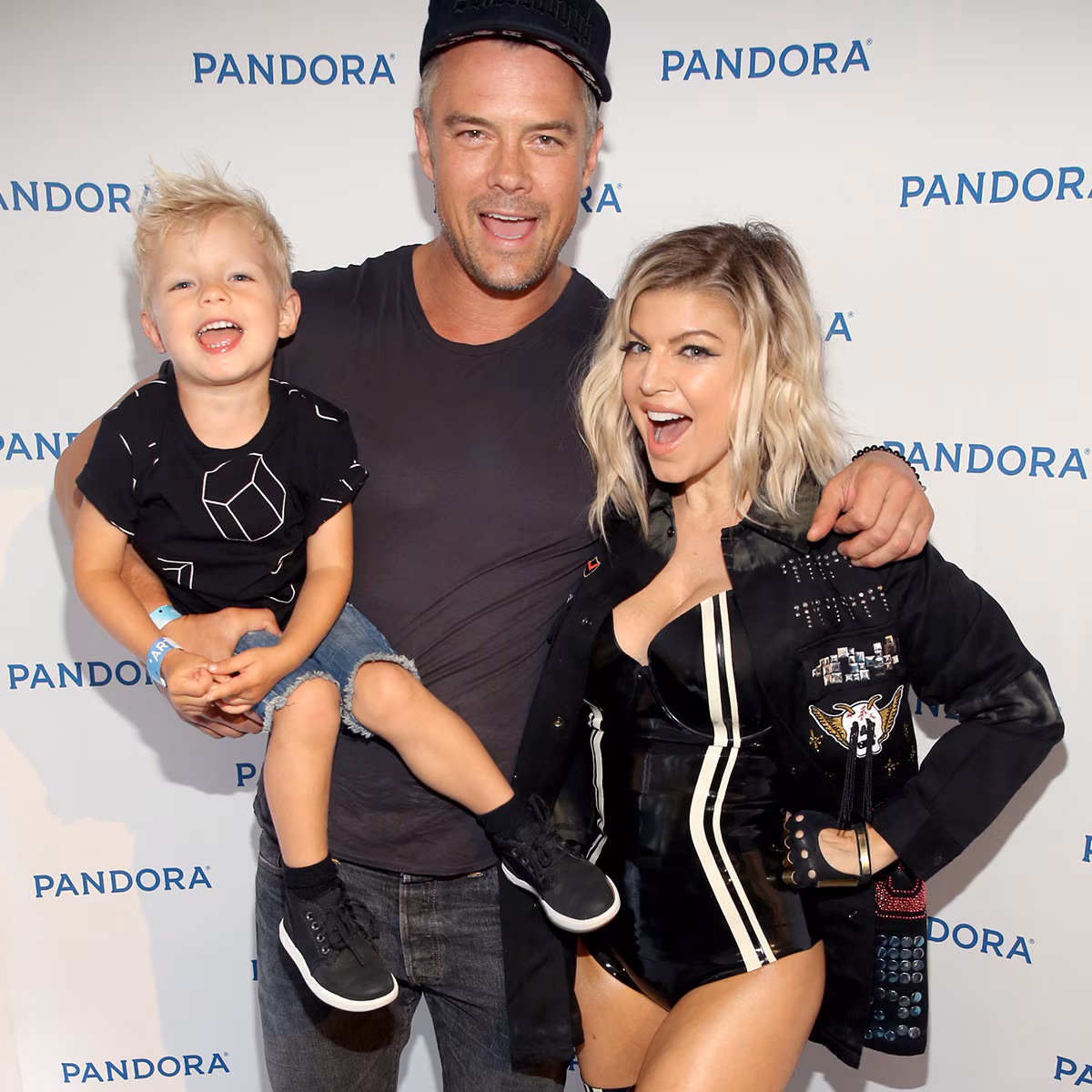 Fergie and Josh Duhamel smiling together while celebrating their son Axl's birthday.