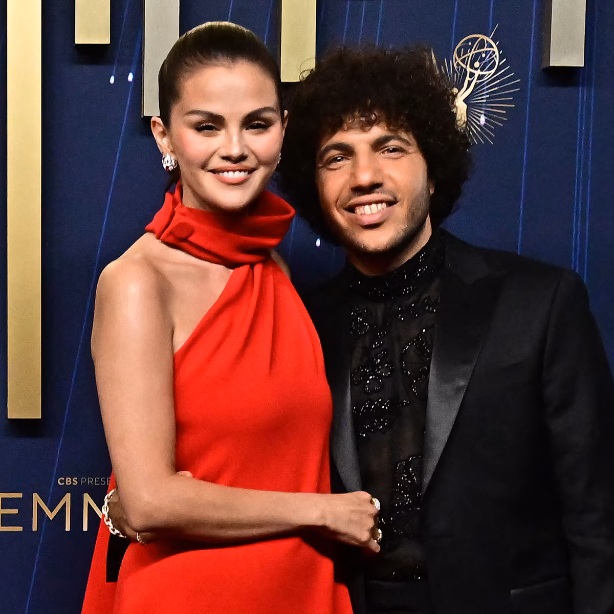 Selena Gomez and Benny Blanco posing together at an awards event