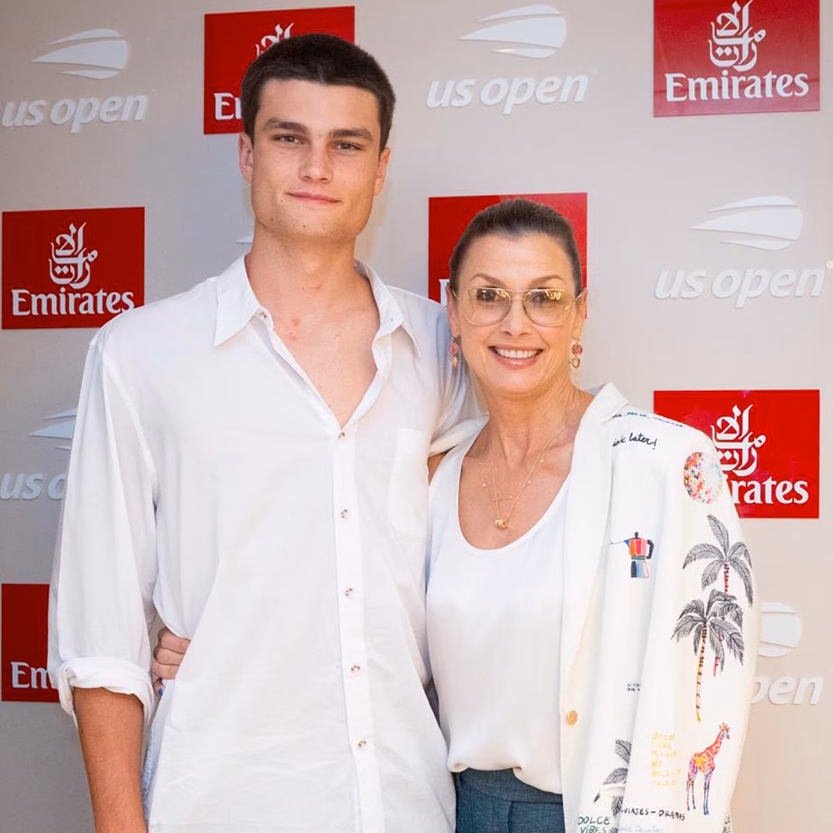 Bridget Moynahan and her son Jack Brady sitting together at the US Open
