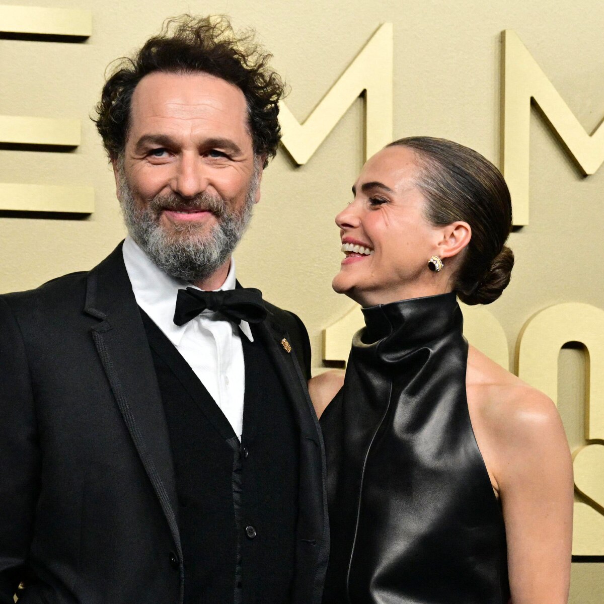 Keri Russell and Matthew Rhys posing together on a red carpet.