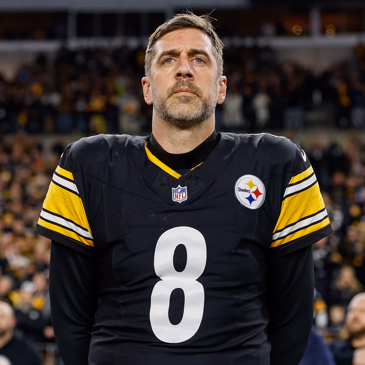 Aaron Rodgers smiling at a public event