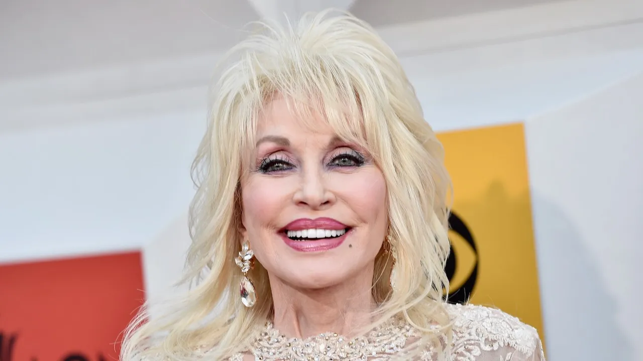 Dolly Parton posing at a music event