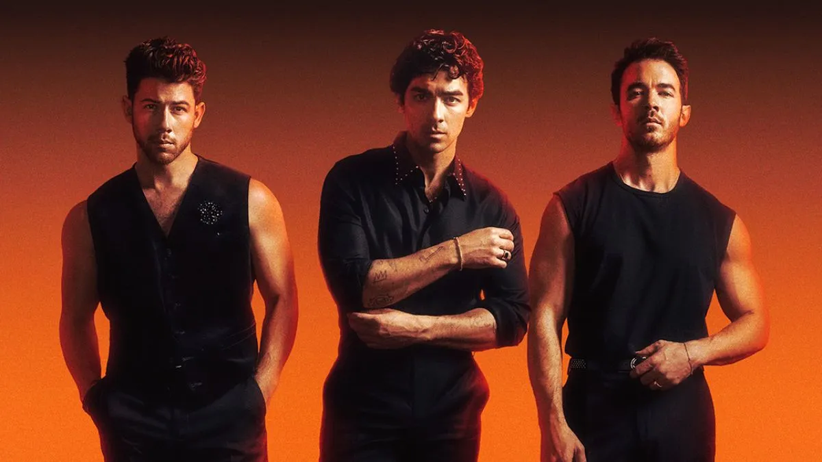 The Jonas Brothers performing live on stage during a concert