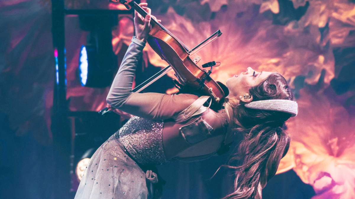 Lindsey Stirling performing live on stage with her violin