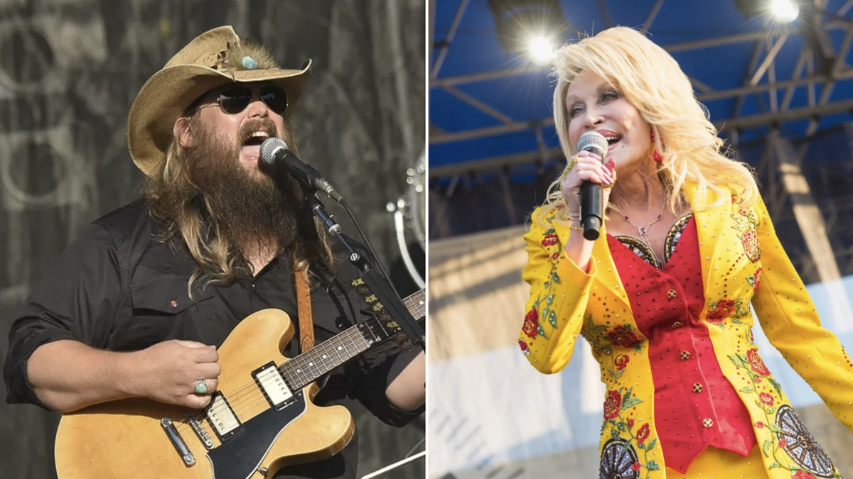 Chris Stapleton performing live on stage with a guitar