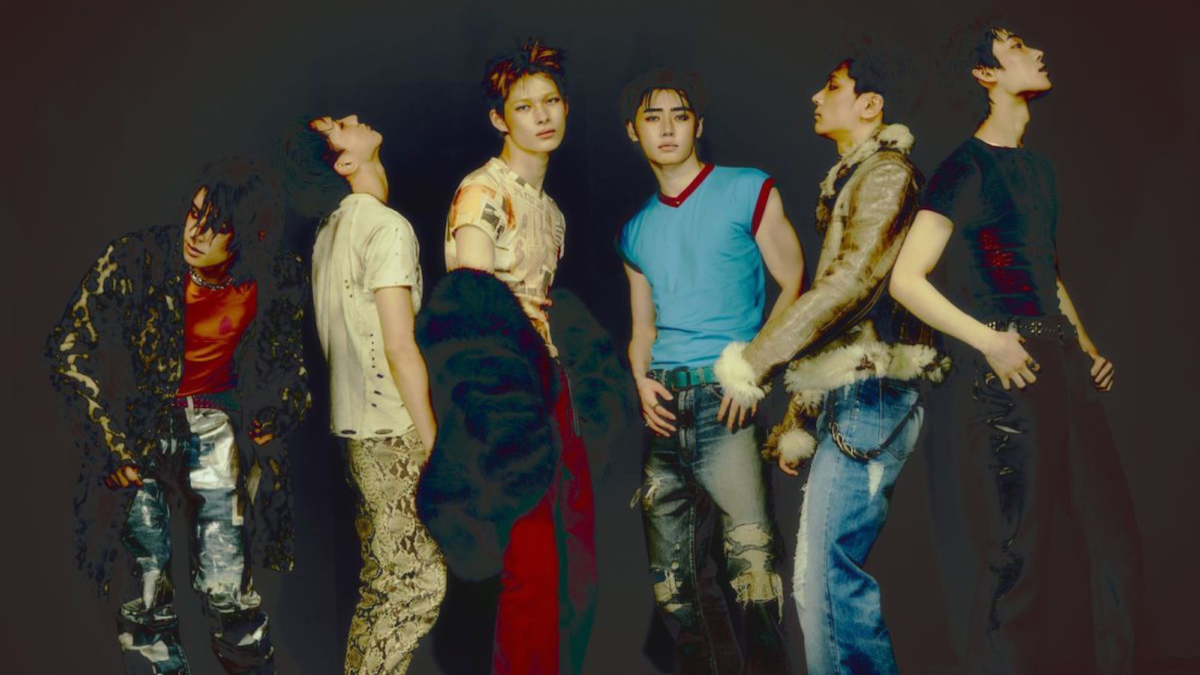 K-pop group ENHYPEN performing on stage during a stadium tour