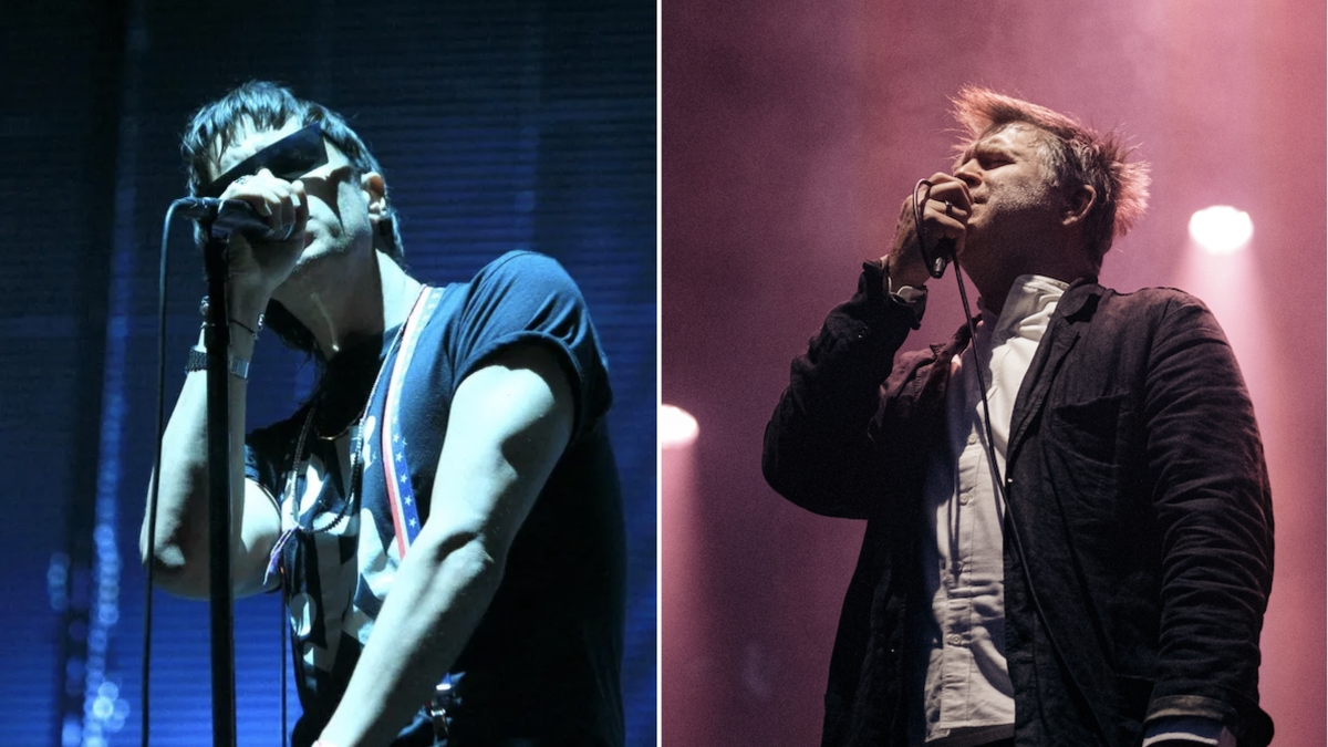 Julian Casablancas performing on stage with a microphone