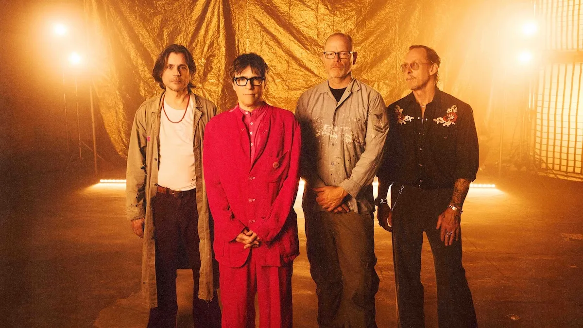 Rivers Cuomo performing live on stage with Weezer