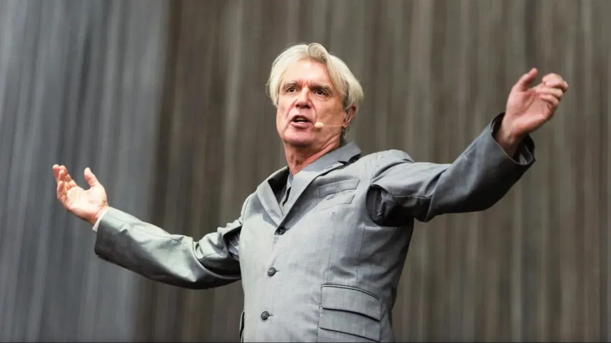 David Byrne performing on stage