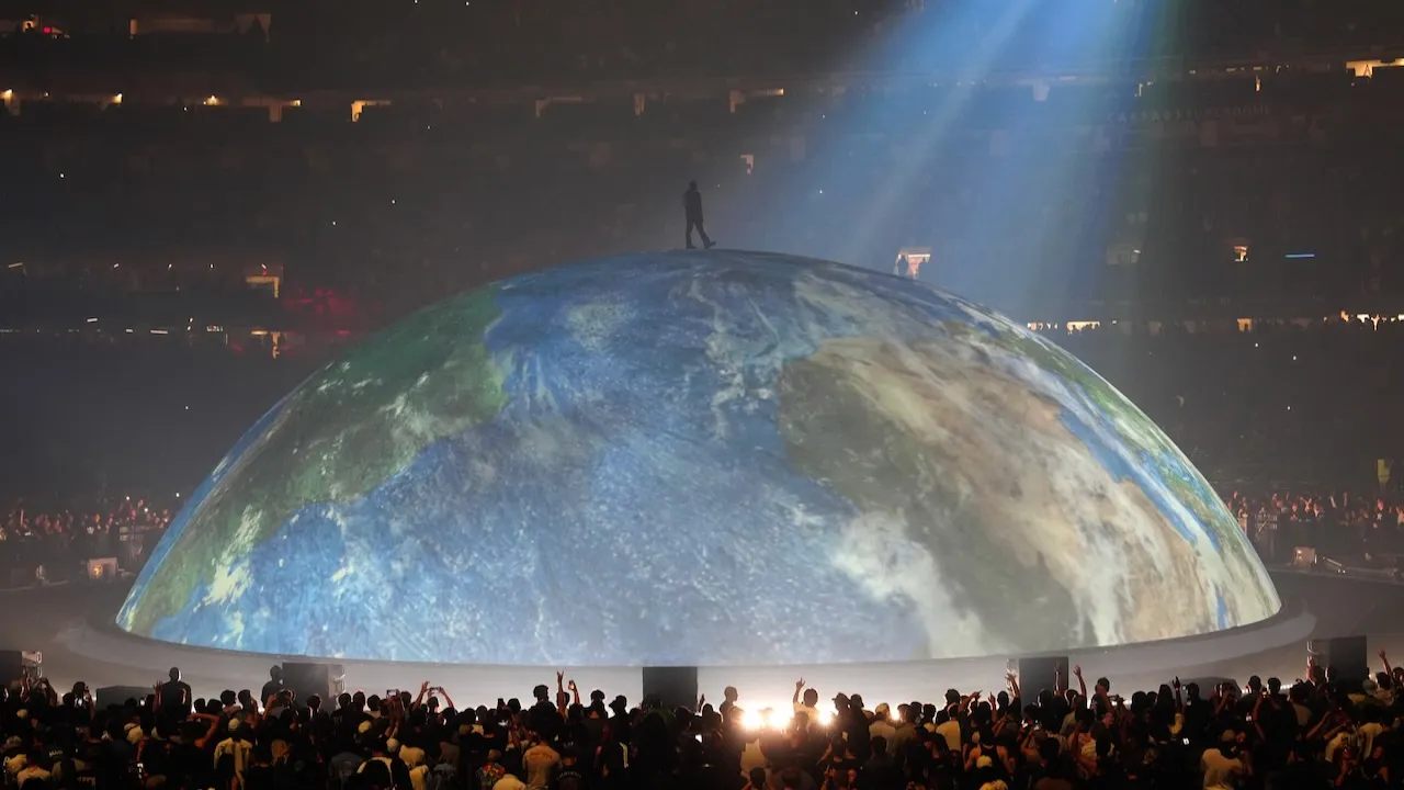 Kanye West performing on stage during a concert