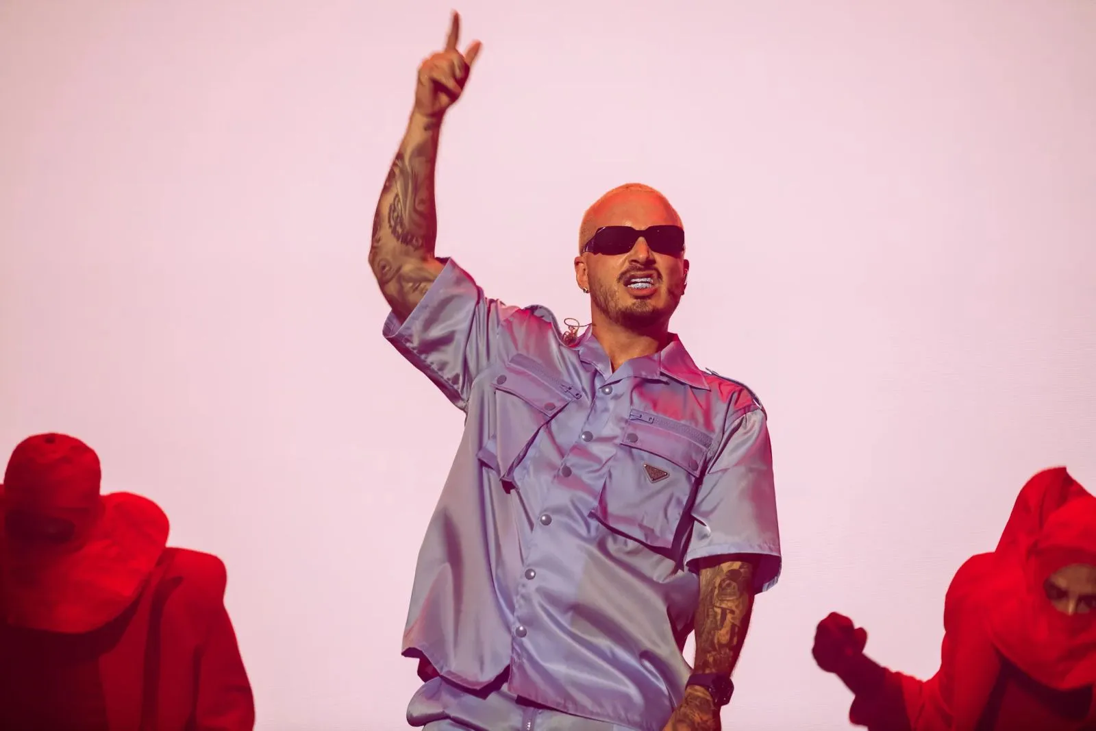 J Balvin performing live on stage under concert lighting