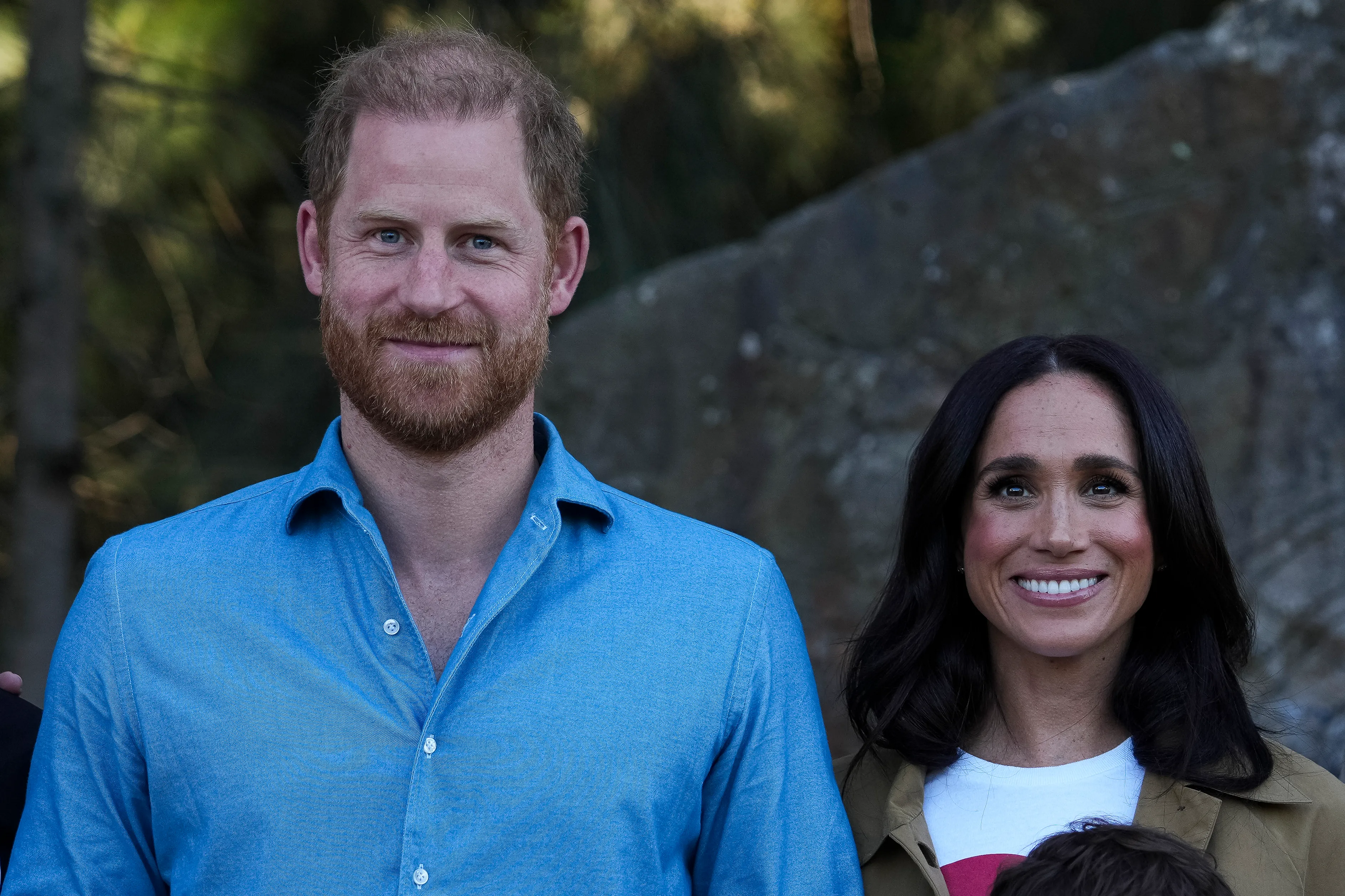 Prince Harry and Meghan Markle posing together at an event