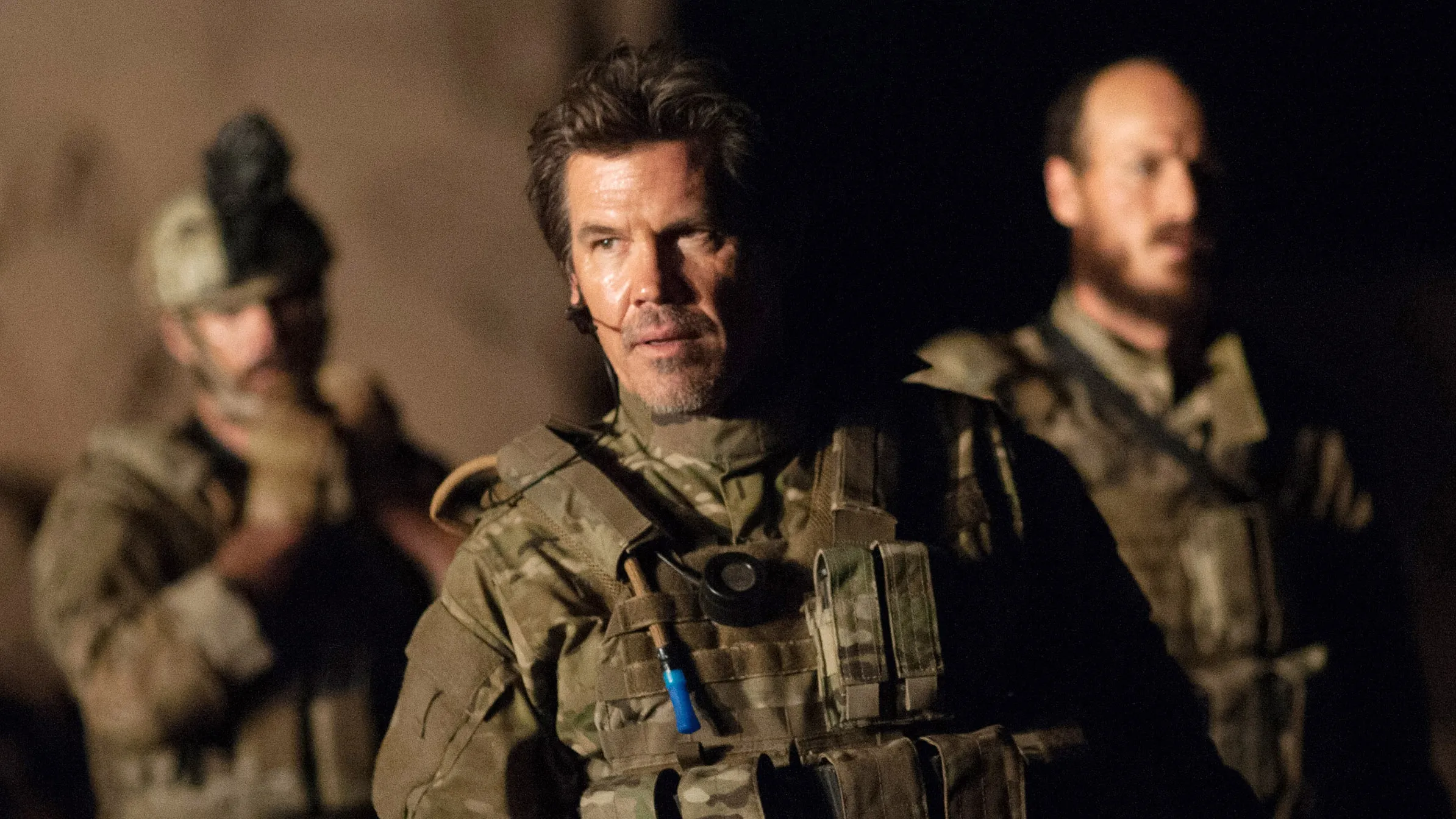 Josh Brolin attending a movie premiere in a sharp suit.