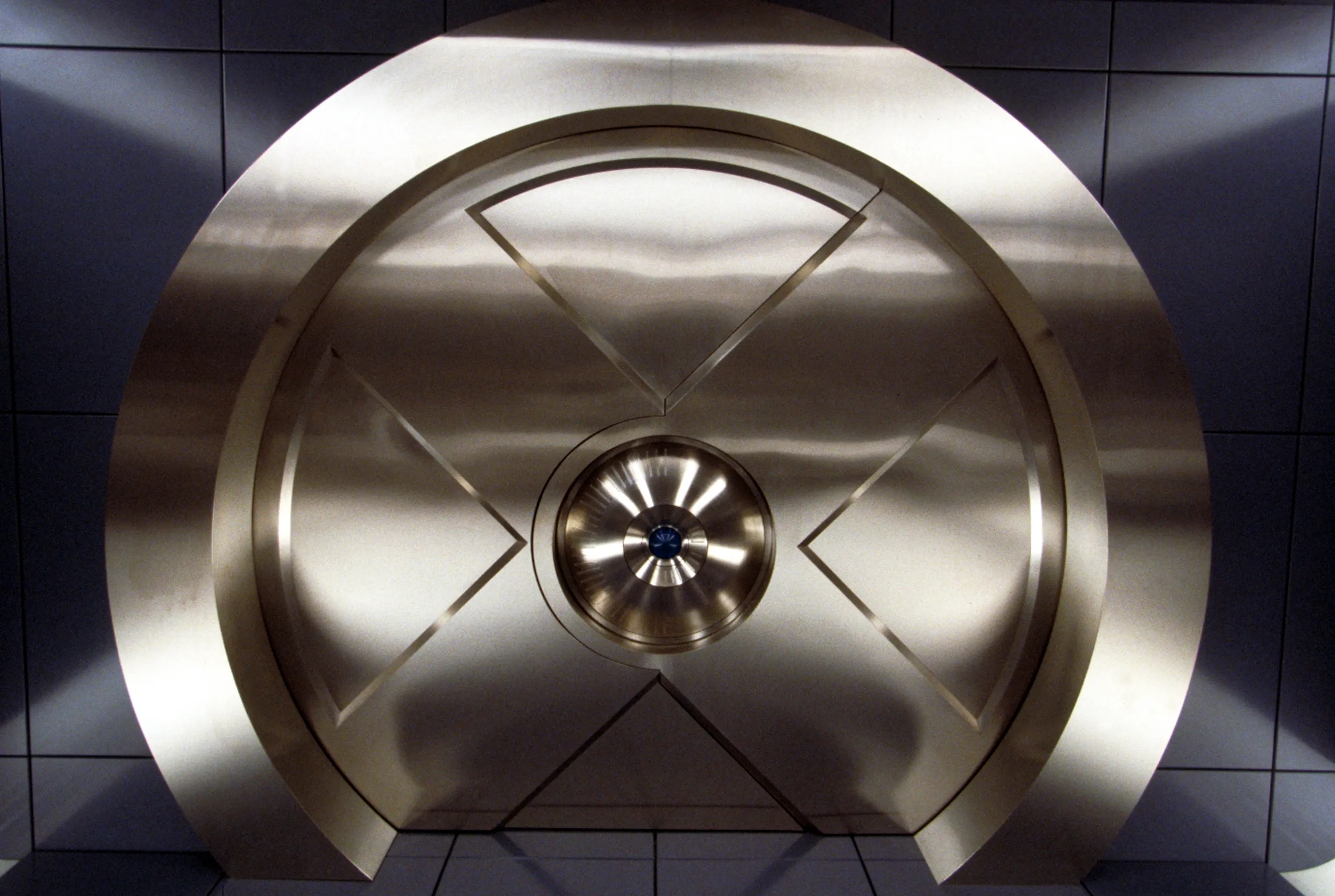 The Marvel Studios logo displayed alongside comic book artwork of the X-Men.