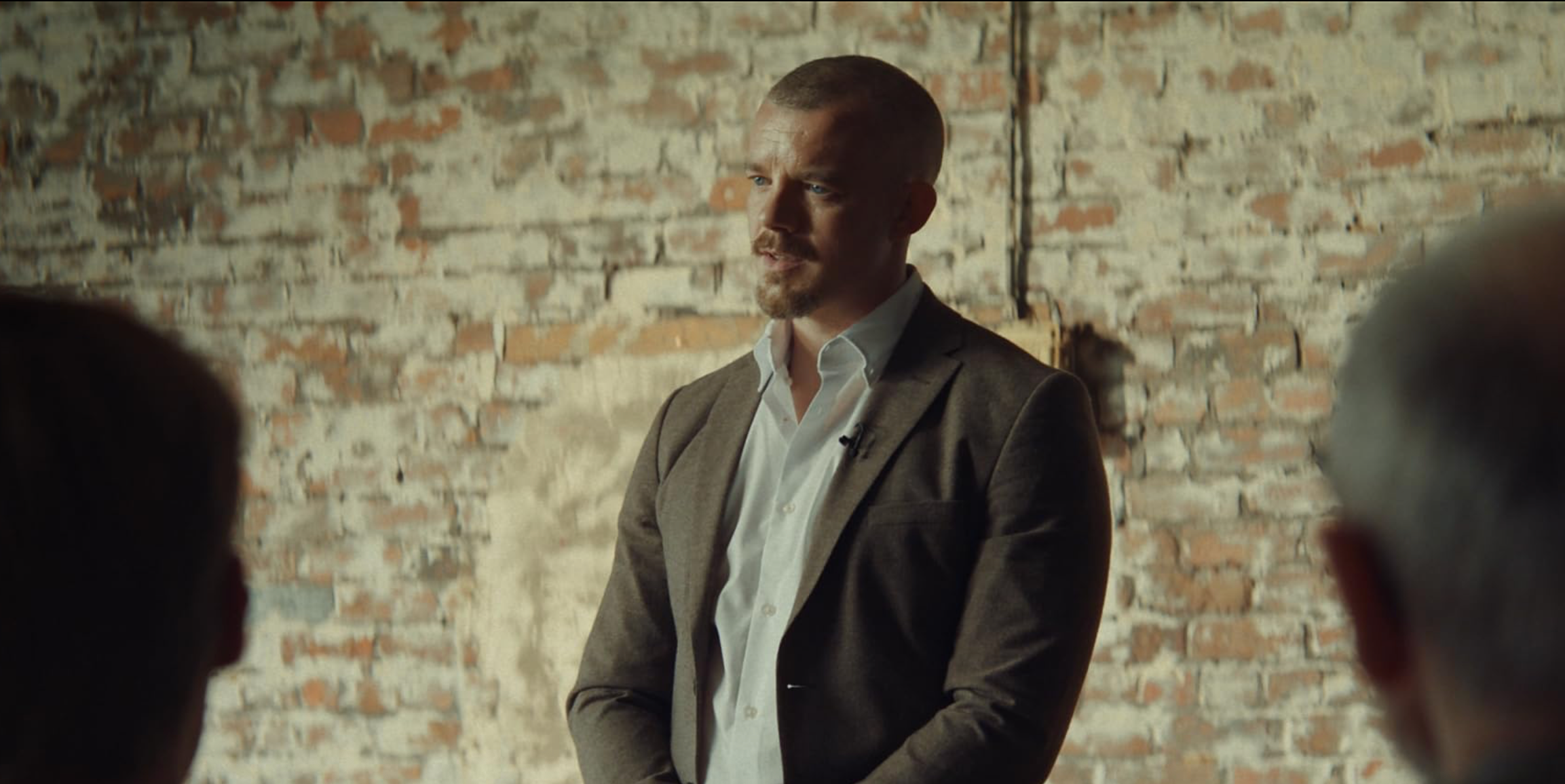 Russell Tovey posing at an event