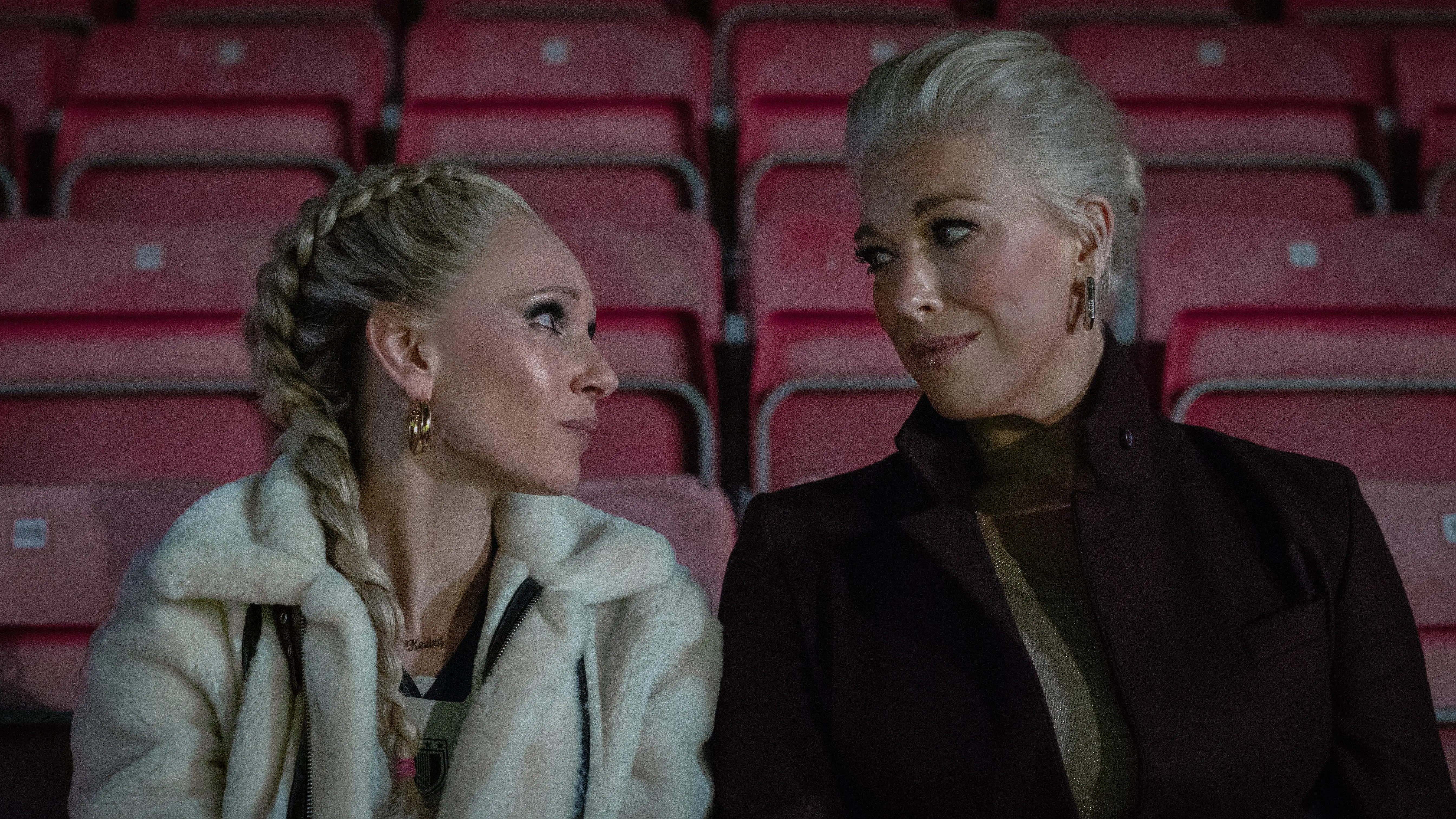 Juno Temple and Hannah Waddingham smiling together on a red carpet