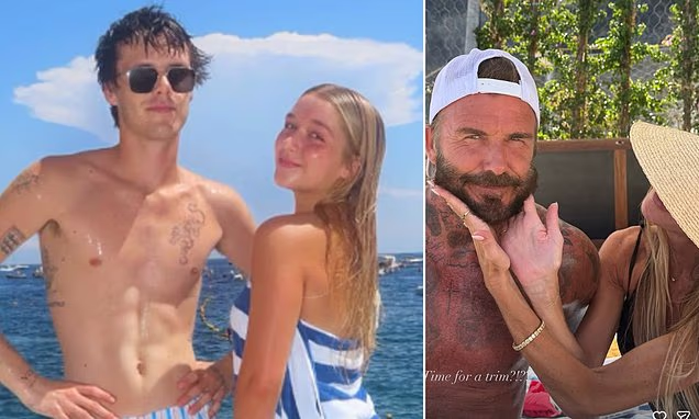 Victoria Beckham and David Beckham posing together on a sunny boat vacation.