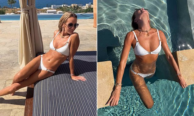 Amanda Holden posing in a white bikini on a sunny trip to Crete
