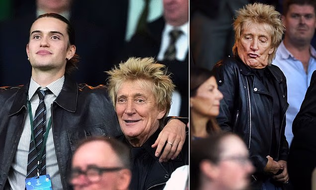 Rod Stewart cheering at a football match alongside his son Alastair