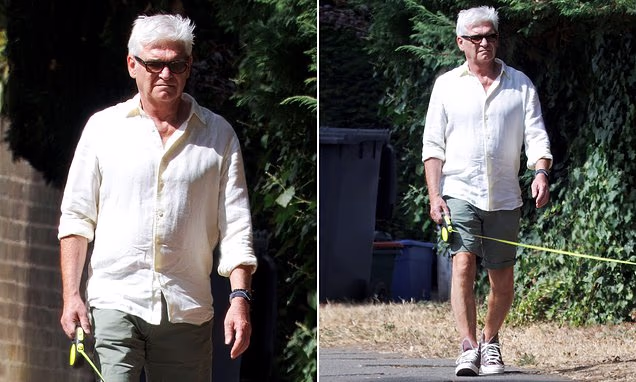 Phillip Schofield walking his dog Alfie in public following Holly Willoughby's YouTube launch